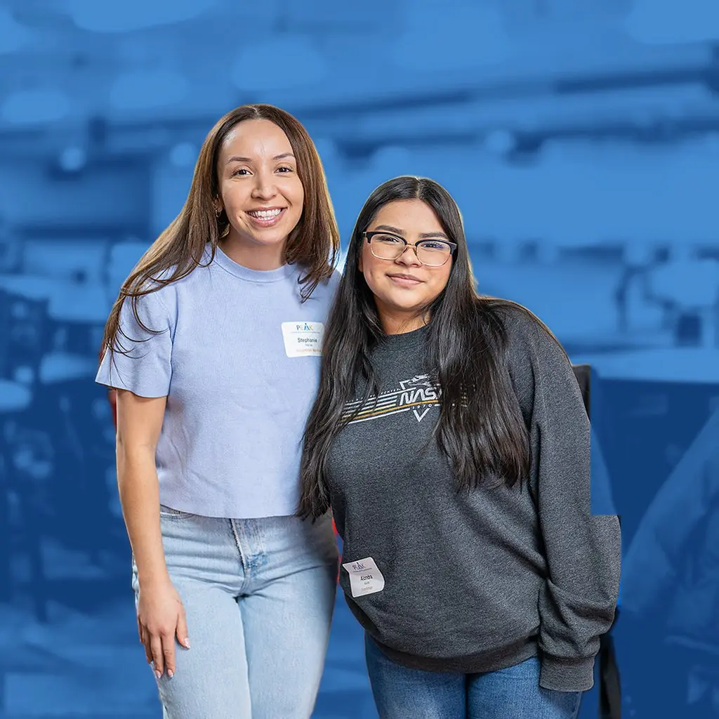 A PEAK mentor and scholar smiling together at an event